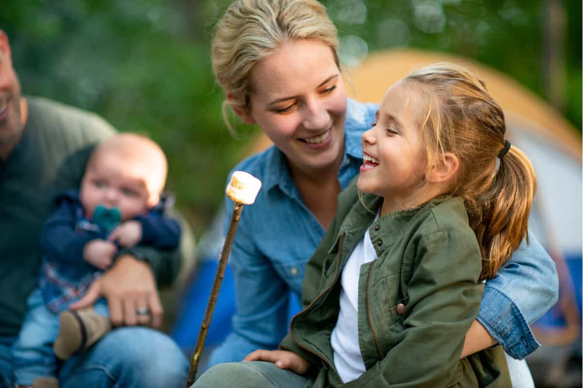 marshmallows-over-a-gas-fire-pit-safe Image of a family with young children roasting marshmallows.