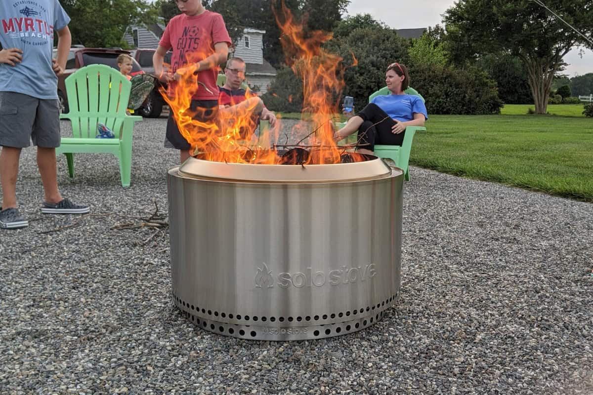 Image of a smokeless fire pit on a gravel drieveway.