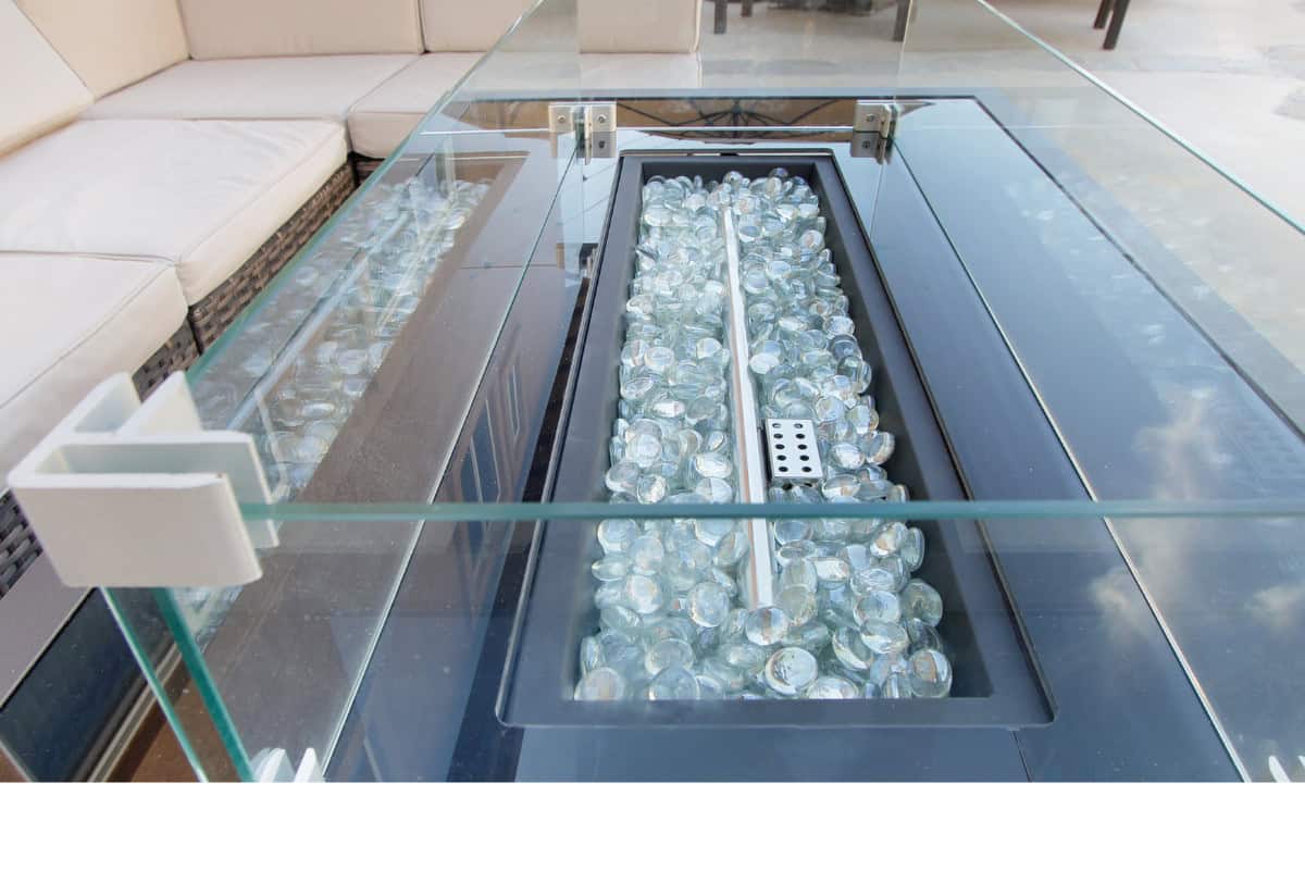 Image of a rectangular gas fire pit with clear fire glass for a blog post