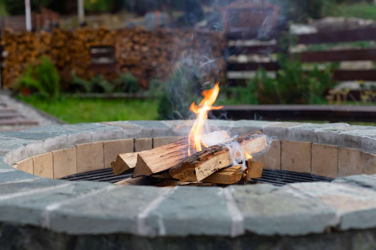 Image of a freshly started wood-burning fire pit.