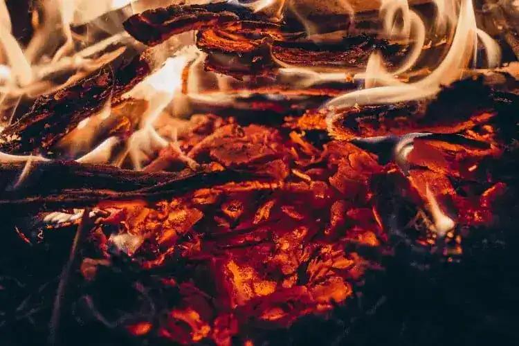 Image of fire pit fire over deckprotect deck shield