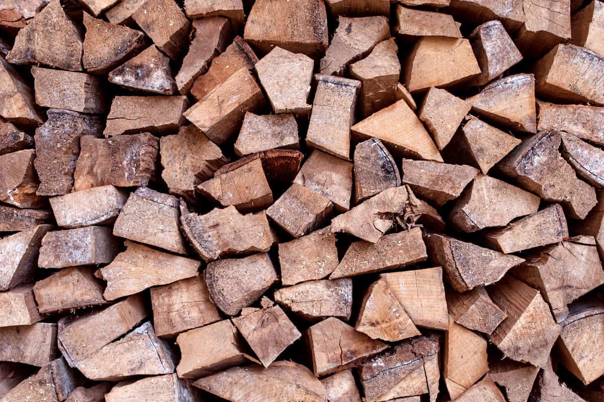 fire-pit-on-decking-maintenance Image of a stack of chopped fire pit firewood.
