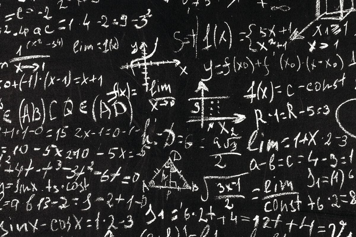 Image of complicated math on a blackboard.