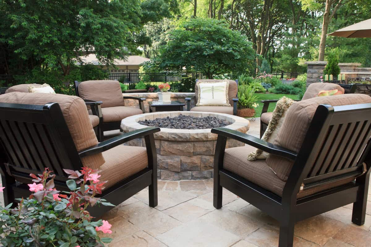 Image a stone block fire pit on a patio for an article covering fire pit adhesives.