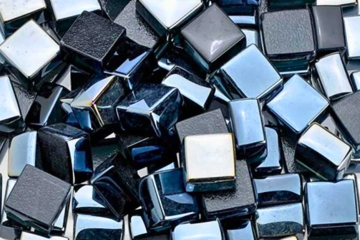 Image of square black fire pit glass for a blog post answering the question "how long does fire pit glass last?"