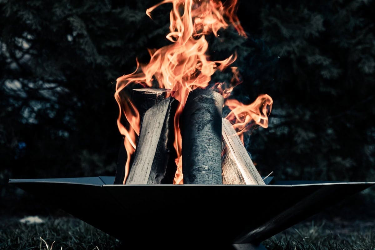 Image of a large fire pit burning for a blog post answering the question "what size fire pit do I need?"