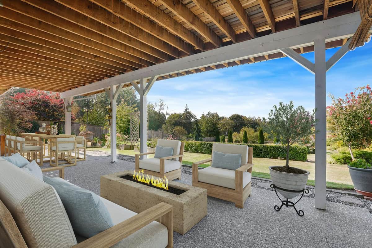 Cozy backyard patio with outdoor furniture, a modern fire pit, and lush garden landscape under a wooden pergola, perfect for outdoor relaxation and entertaining.
